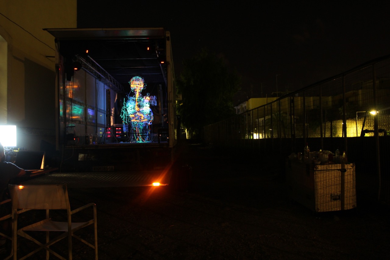 Kalliplokamos glowing inside the open cargo hold of its category C truck at night.