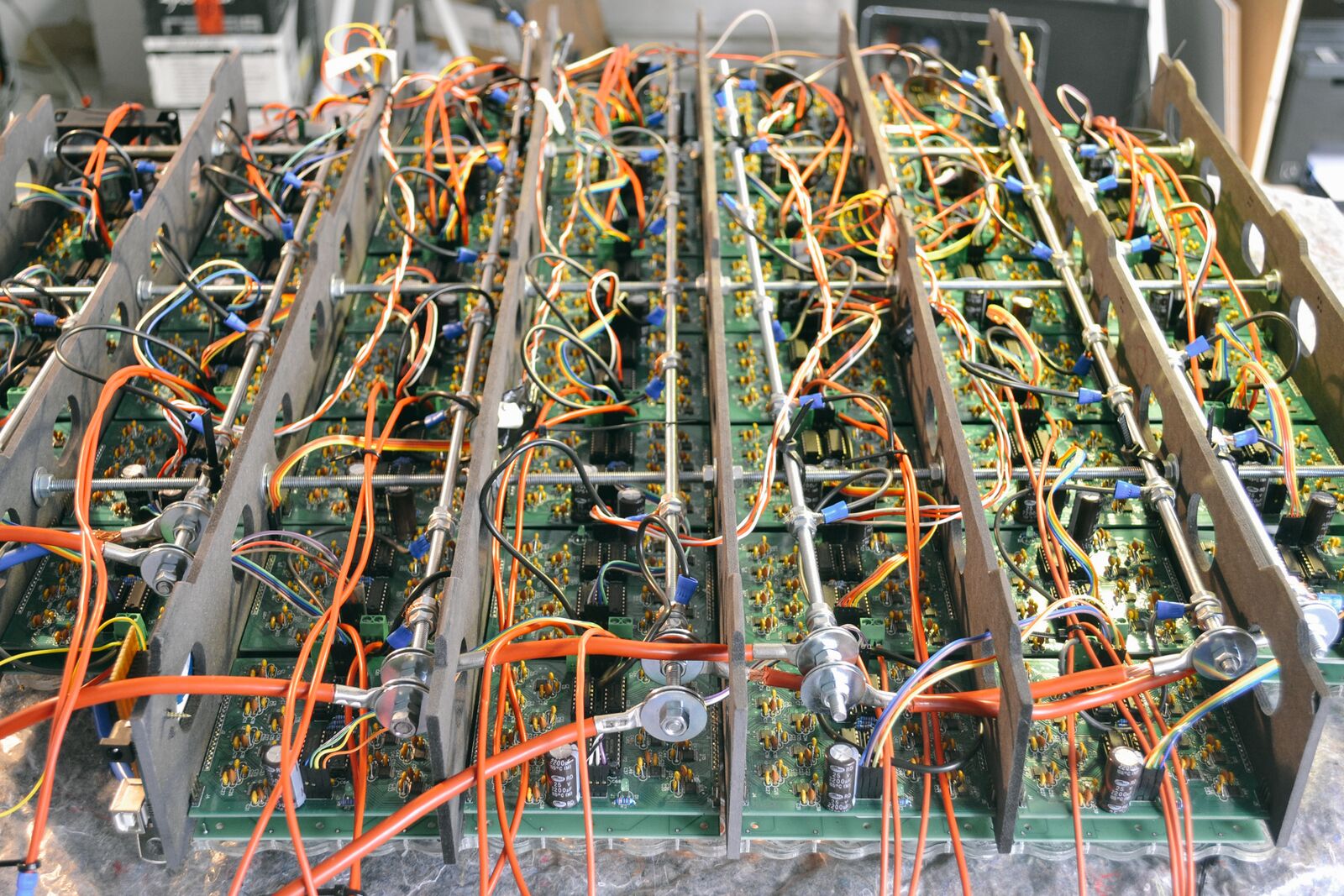 Closer angle on the wired driver boards ringing the electromagnet grid.